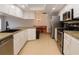 Well-equipped kitchen featuring stainless steel appliances, ample white cabinetry, and breakfast nook at 4190 Lema Dr, Spring Hill, FL 34609