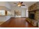 Open-concept living area featuring a stone fireplace and wet bar, perfect for entertaining guests at 4190 Lema Dr, Spring Hill, FL 34609