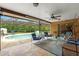 Screened-in pool area with comfortable seating and views of lush landscaping at 4190 Lema Dr, Spring Hill, FL 34609