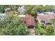 Overhead shot showcases the home's roof and driveway, nestled in a lush, green neighborhood at 4420 Marine Pkwy, New Port Richey, FL 34652