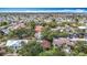 Aerial view of a residential community with lush trees, canals, and a beautiful waterfront vista at 4420 Marine Pkwy, New Port Richey, FL 34652