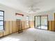 Bright bedroom with ceiling fan, window and sliding glass door to screen porch at 4420 Marine Pkwy, New Port Richey, FL 34652
