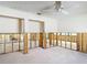 Spacious bedroom featuring two closets and ceiling fan ready to be remodeled at 4420 Marine Pkwy, New Port Richey, FL 34652