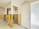 Interior view of the house entrance, featuring white tiled flooring and exposed wall framework at 4420 Marine Pkwy, New Port Richey, FL 34652