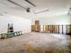 Garage interior featuring ladder and access door ready for renovation at 4420 Marine Pkwy, New Port Richey, FL 34652