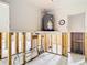 Garage featuring water heater and open concept ready for renovation at 4420 Marine Pkwy, New Port Richey, FL 34652