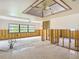 Spacious area with wall studs ready for renovation and a ceiling fan at 4420 Marine Pkwy, New Port Richey, FL 34652