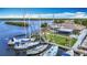 Aerial view of boats docked at the Gulf Harbour Yacht Club, featuring well-maintained landscaping and waterfront access at 4420 Marine Pkwy, New Port Richey, FL 34652