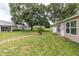 Well-maintained backyard with a patio, lush lawn and landscaping providing a serene outdoor space at 4837 Boonesboro Ct, New Port Richey, FL 34655