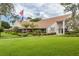View of the Heritage Lake Clubhouse and landscaping at 4837 Boonesboro Ct, New Port Richey, FL 34655