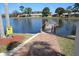 Dock overlooking a serene lake at 4837 Boonesboro Ct, New Port Richey, FL 34655