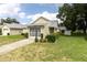 Charming single-story home with a screened front porch and well-maintained landscaping at 4837 Boonesboro Ct, New Port Richey, FL 34655