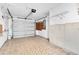 Spacious two car garage offering ample parking and storage space with garage door at 4837 Boonesboro Ct, New Port Richey, FL 34655