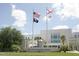 West Pasco Government Center with American, Florida, and POW flags waving in the wind at 4837 Boonesboro Ct, New Port Richey, FL 34655