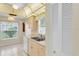 Kitchen featuring light wood cabinets, tile flooring, and stainless steel sink at 4837 Boonesboro Ct, New Port Richey, FL 34655