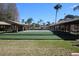 Manicured lawn bowling area featuring sheltered benches in a beautiful community setting at 4837 Boonesboro Ct, New Port Richey, FL 34655