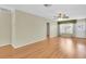 Bright living room with wood floors, a ceiling fan, and natural light at 4837 Boonesboro Ct, New Port Richey, FL 34655