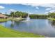Beautiful view of the pond with a fountain at 4837 Boonesboro Ct, New Port Richey, FL 34655
