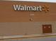 Exterior of Walmart retail store with signage on a beige concrete building, located at 8745 at 4837 Boonesboro Ct, New Port Richey, FL 34655