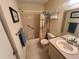 Full bathroom with a tiled floor, shower-tub combo, and a well-lit vanity area at 4903 Myrtle Oak Dr # 12, New Port Richey, FL 34653