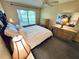 Spacious bedroom boasts a ceiling fan and a bright window, creating a relaxing atmosphere at 4903 Myrtle Oak Dr # 12, New Port Richey, FL 34653