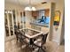 Elegant dining room featuring stylish furniture, a chandelier, and views into the kitchen, ideal for entertaining at 4903 Myrtle Oak Dr # 12, New Port Richey, FL 34653