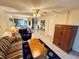 Open living area showcasing tile flooring, ceiling fan, and seamless flow into dining space at 4903 Myrtle Oak Dr # 12, New Port Richey, FL 34653