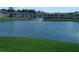 Relax by the tranquil pond, enhanced by a fountain, adding a touch of serenity to the surroundings at 4903 Myrtle Oak Dr # 12, New Port Richey, FL 34653