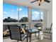 Waterfront views from the balcony, furnished with chairs and a small table, perfect for relaxing at 4939 Floramar Ter # 204, New Port Richey, FL 34652