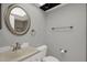 Updated bathroom features a new vanity, decorative mirror and modern fixtures at 4939 Floramar Ter # 204, New Port Richey, FL 34652