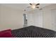 This bedroom features a ceiling fan, and an ample closet for storage at 4939 Floramar Ter # 204, New Port Richey, FL 34652