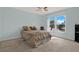 Serene bedroom with large windows offering panoramic views of the waterfront, filling the space with natural light at 4939 Floramar Ter # 204, New Port Richey, FL 34652