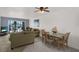 Inviting living and dining area offering views of waterfront, creating a serene atmosphere for relaxation and entertaining at 4939 Floramar Ter # 204, New Port Richey, FL 34652