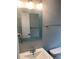 Updated bathroom with a sink, toilet, and decorative mirror at 5023 Queen Palm Dr, New Port Richey, FL 34652