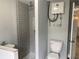 Well-lit bathroom with a tiled shower and modern fixtures at 5023 Queen Palm Dr, New Port Richey, FL 34652