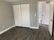 Cozy bedroom featuring a double door closet and updated bathroom at 5023 Queen Palm Dr, New Port Richey, FL 34652
