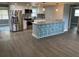 Bright kitchen featuring stainless steel appliances, granite countertops, and a decorative backsplash at 5023 Queen Palm Dr, New Port Richey, FL 34652