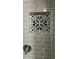 Close-up of a tiled shower niche with decorative black and white tile at 5023 Queen Palm Dr, New Port Richey, FL 34652