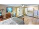 Spacious living room offering a kitchenette, full bed, seating area and bathroom access at 5152 Panther Dr, Spring Hill, FL 34607