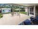 View of patio featuring a decorative concrete and chairs surrounding glass table at 5152 Panther Dr, Spring Hill, FL 34607