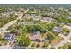 Aerial view shows the property with mature trees at 5216 Hope Ln, Spring Hill, FL 34606