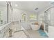 Luxurious bathroom with granite counters, soaking tub and shower at 5216 Hope Ln, Spring Hill, FL 34606