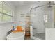 Modern bathroom with soaking tub and glass-enclosed shower at 5216 Hope Ln, Spring Hill, FL 34606