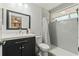 Bright bathroom features a shower/tub combination, vanity, toilet, and a window for natural light at 5216 Hope Ln, Spring Hill, FL 34606