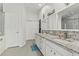 Bright bathroom featuring granite counters and updated fixtures at 5216 Hope Ln, Spring Hill, FL 34606