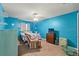 Cozy bedroom with neutral carpet, recliner and entertainment center at 5216 Hope Ln, Spring Hill, FL 34606