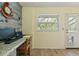 Home office with work space and window view of pool at 5216 Hope Ln, Spring Hill, FL 34606