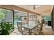 Covered outdoor dining area with a view of the pool at 5216 Hope Ln, Spring Hill, FL 34606