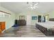 Primary bedroom with light green walls and vaulted ceiling at 5216 Hope Ln, Spring Hill, FL 34606