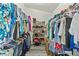 Organized walk-in closet with shelving for clothes and shoes, offering ample storage space at 5216 Hope Ln, Spring Hill, FL 34606